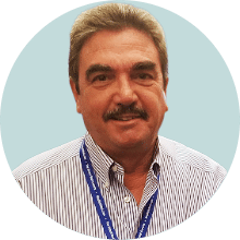 Professional headshot of Gary K in a collared shirt, neutral background.